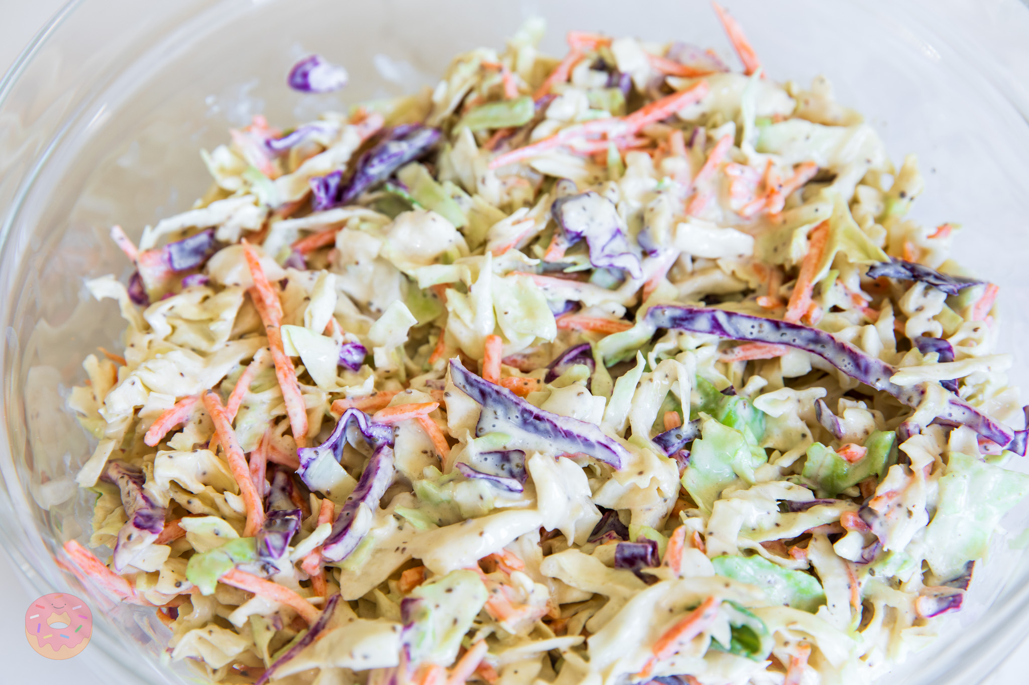 Close-up of the best coleslaw with labne showing crisp shredded cabbage, carrots, and creamy tangy dressing, lighter no-mayo version