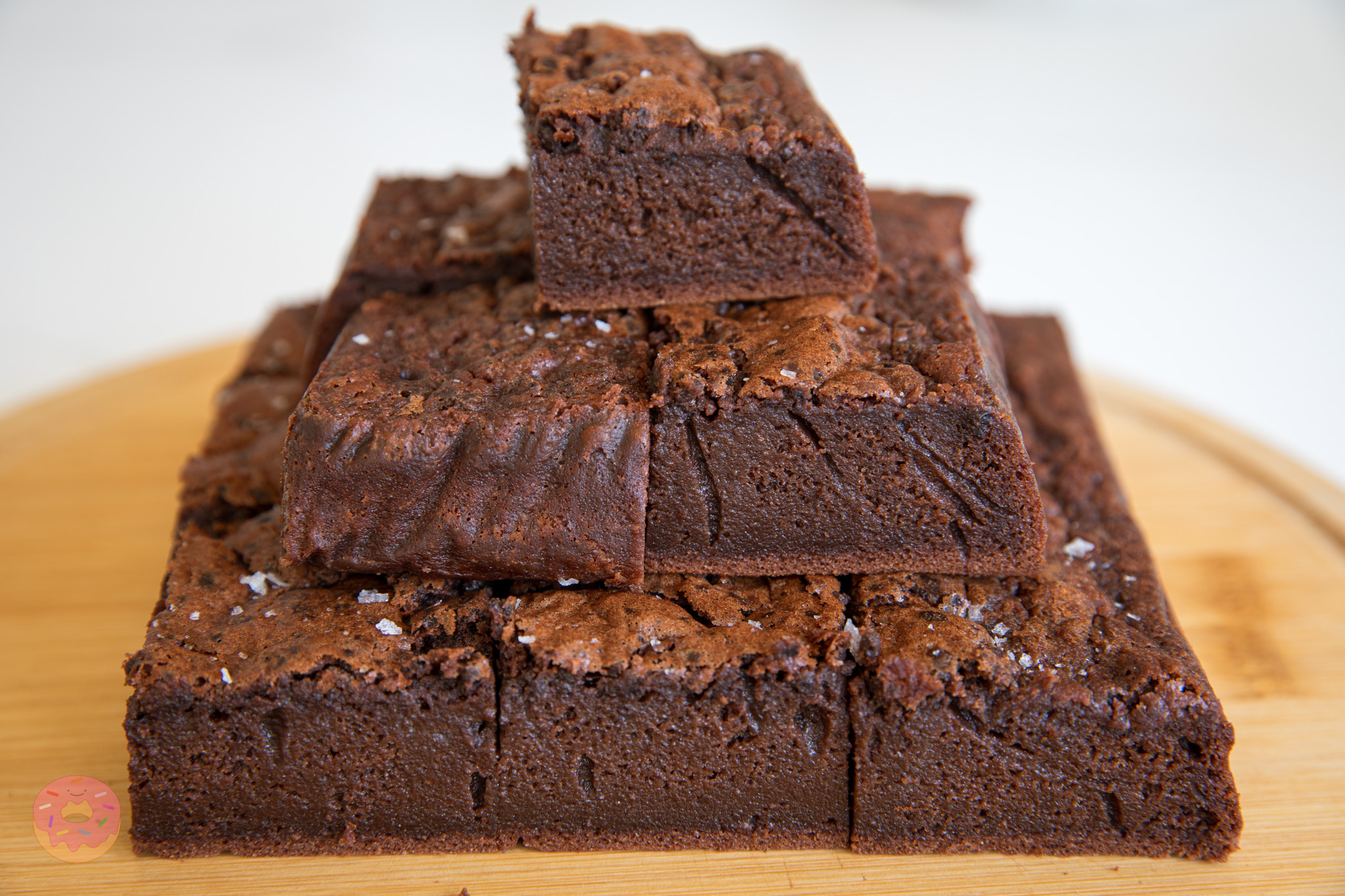 Rich and fudgy mochi brownies cut into squares, showing their signature chewy texture and glossy crackly top